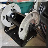 T31. Rockler dust collecting hose reel. 